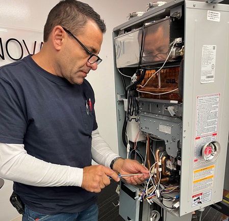 joseph repairing a tankless water heater.