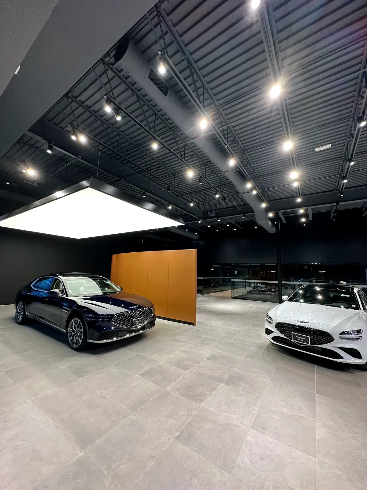 Modern automotive showroom illuminated by architectural LED lighting