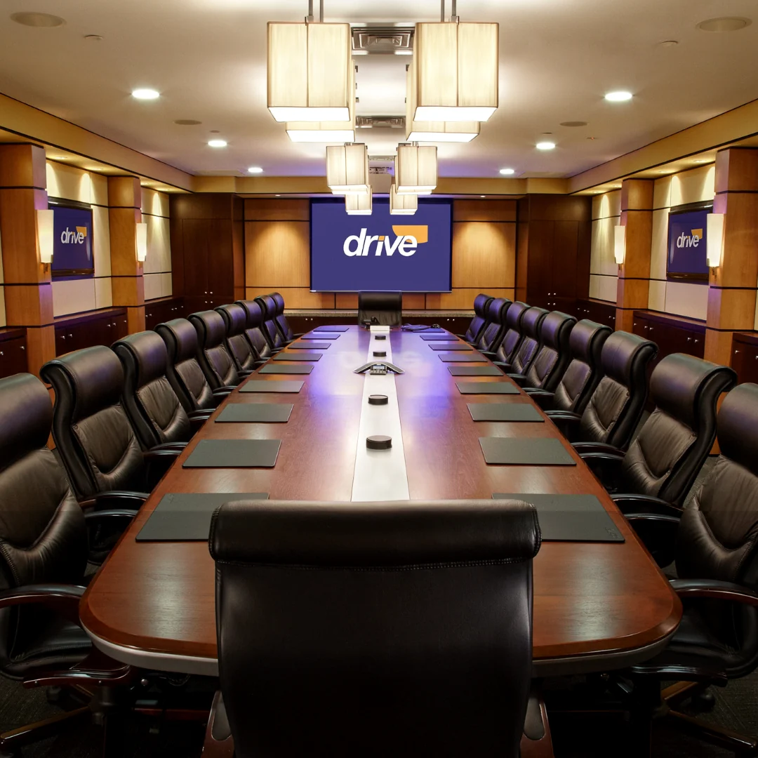 Drive Medical boardroom with layered commercial LED lighting and executive conference table