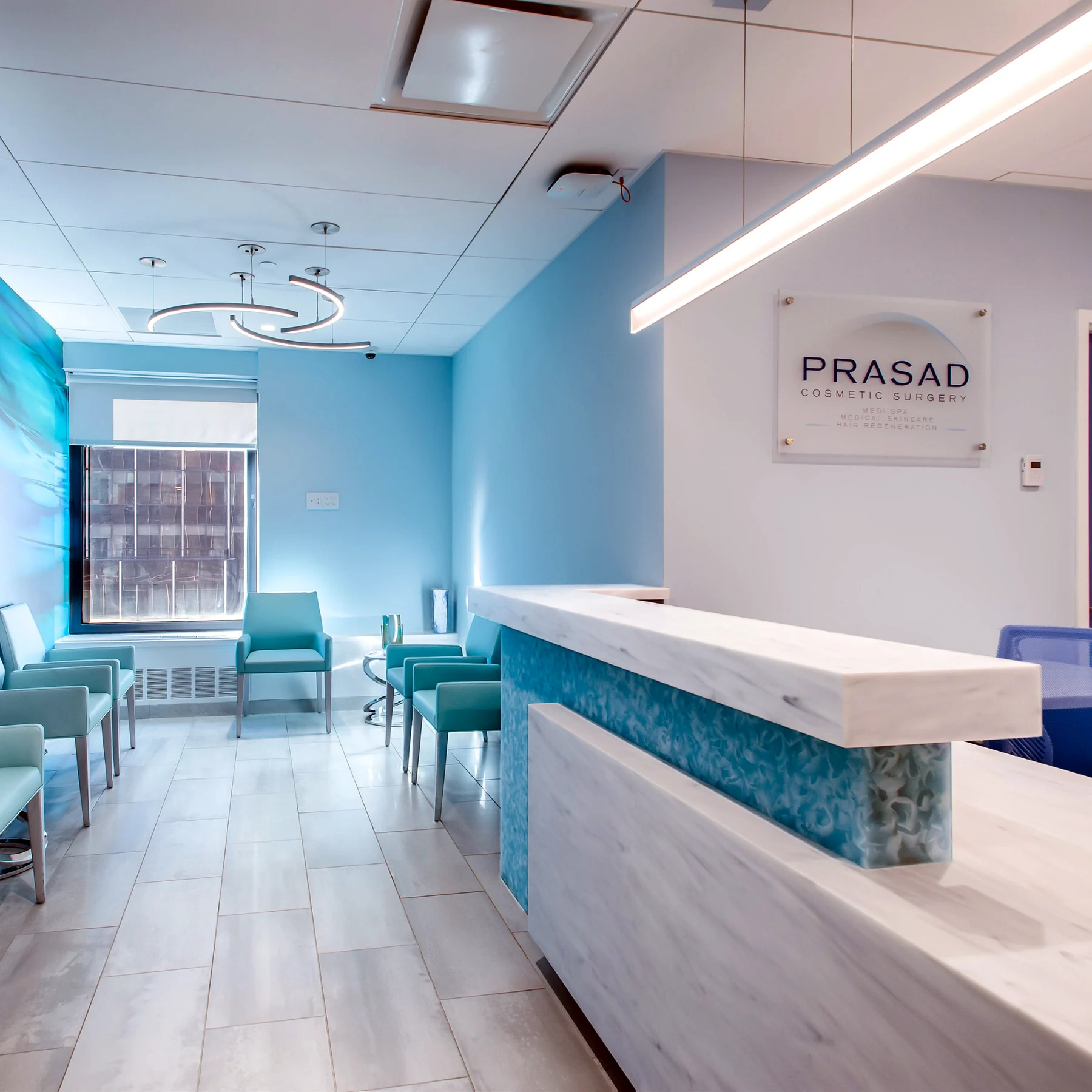 Prasad Cosmetic Surgery reception with modern linear and ring-style commercial LED lighting